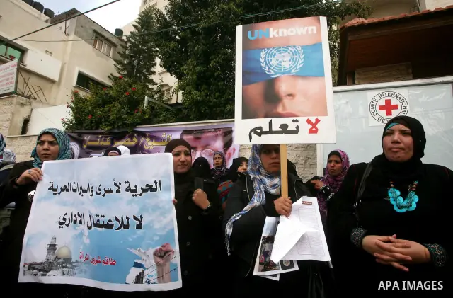 Palestinians,take part in a protest in front of French Center calling for release of Palestinian prisoner Khader Adnan, a member of the Islamic Jihad militant group, in Gaza City, February 14, 2012. Adnan has been on hun...