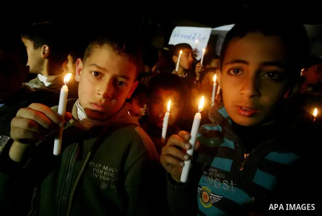 Palestinian schoolchildren hold up candles during a portest in Gaza City calling for supplying the Gaza Strip with enough fuel on February 14, 2012. The impoverished territory's sole power plant, which supplies around a...