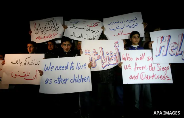 Palestinian schoolchildren hold up candles during a portest in Gaza City calling for supplying the Gaza Strip with enough fuel on February 14, 2012. The impoverished territory's sole power plant, which supplies around a...