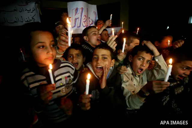 Palestinian schoolchildren hold up candles during a portest in Gaza City calling for supplying the Gaza Strip with enough fuel on February 14, 2012. The impoverished territory's sole power plant, which supplies around a...