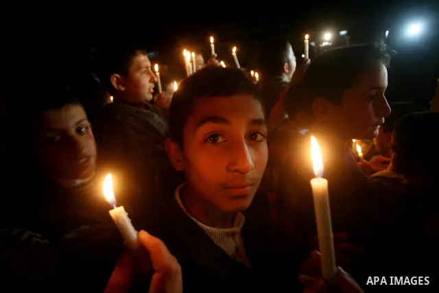 Palestinian schoolchildren hold up candles during a portest in Gaza City calling for supplying the Gaza Strip with enough fuel on February 14, 2012. The impoverished territory's sole power plant, which supplies around a...