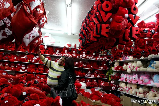 A Palestinian arranges a display of gifts in a shop on Valentine's Day in the West Bank City of Ramallah,14 February 2012. Photo by Issam Rimawi