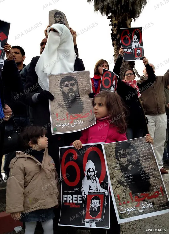 Randa, the wife of Palestinian prisoner Khader Adnan (poster), a jailed senior member of Islamic Jihad who has been on hunger strike for nearly 60 days, during a protest outside Zief hospital in Safad, on February 15, 20...