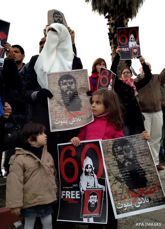 Randa, the wife of Palestinian prisoner Khader Adnan (poster), a jailed senior member of Islamic Jihad who has been on hunger strike for nearly 60 days, during a protest outside Zief hospital in Safad, on February 15, 20...