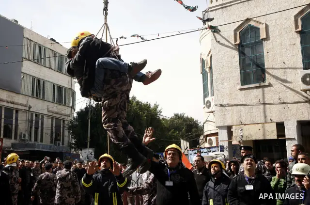 Palestinian firefighters take part in an earthquake drill organised by the civil defence forces in the West Bank city of Jenin on February 16, 2012. Photo by Wagdi Eshtayah