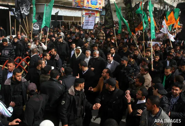 Islamic Jihad activists protest after the Friday noon prayer in support of Khader Adnan, a fellow Palestinian senior militant held in an Israeli prison without trial and who is on hunger strike since December 18, on Febr...