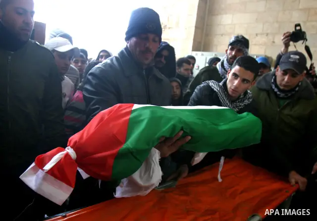 Palestinians take part in the funeral of a child, one of schoolchildren killed in a school bus accident, at Al-Aqsa mosque on Feb.17, 2012. A truck lost control in slick, rainy weather and barreled into a Palestinian sch...
