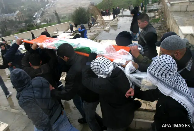 Palestinians take part in the funeral of a child, one of schoolchildren killed in a school bus accident, at Al-Aqsa mosque on Feb.17, 2012. A truck lost control in slick, rainy weather and barreled into a Palestinian sch...