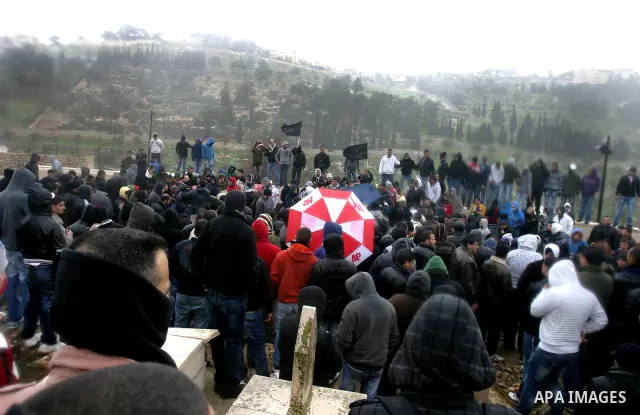 Palestinians take part in the funeral of a child, one of schoolchildren killed in a school bus accident, at Al-Aqsa mosque on Feb.17, 2012. A truck lost control in slick, rainy weather and barreled into a Palestinian sch...