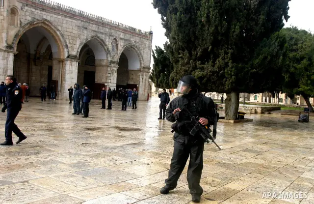 Israeli riot police at the doors to the al-Aqsa Mosque on the Hareem el-Sharif (the Noble Sanctuary), or Temple Mount, in Jerusalem, 19 February 2012, as they battle Palestinians inside during clashes. Israeli police rep...