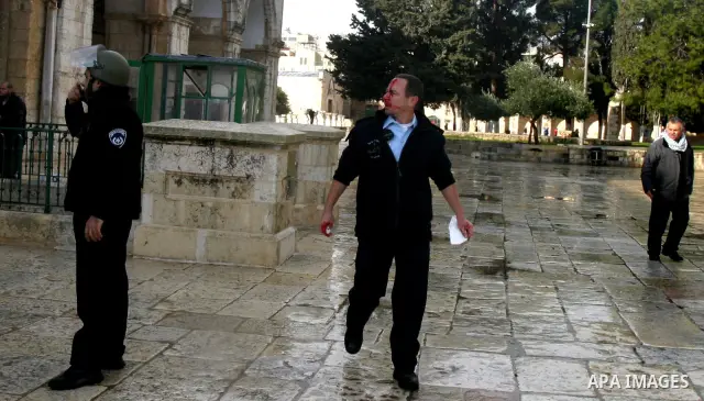 Israeli riot police at the doors to the al-Aqsa Mosque on the Hareem el-Sharif (the Noble Sanctuary), or Temple Mount, in Jerusalem, 19 February 2012, as they battle Palestinians inside during clashes. Israeli police rep...