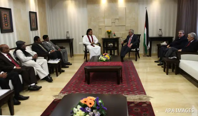 Palestinian Prime Minister, Salam Fayyad meets with presidential envoy on Sri Lanka, Namal Rajpxh, in the West Bank city of Ramallah on Feb, 19, 2012. photo by Mustafa Abu Dayeh.