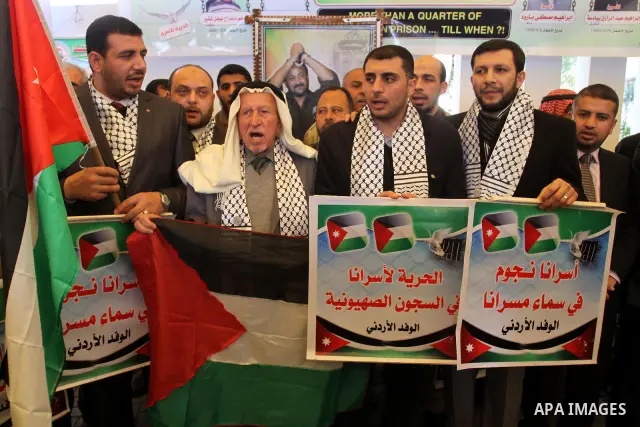 Jordanian delegation take part a protest in front of the Red Cross in Gaza City, calling for the release of Palestinian prisoners from Israeli jails February 20, 2012. Adnan has been on hunger strike for 65 days to prote...