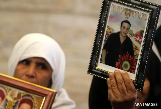 Palestinians women hold posters depicting Palestinian prisoner Khader Adnan, a member of the Islamic Jihad militant group, during a protest in front of the Red Cross in Gaza City, calling for the release of Palestinian p...