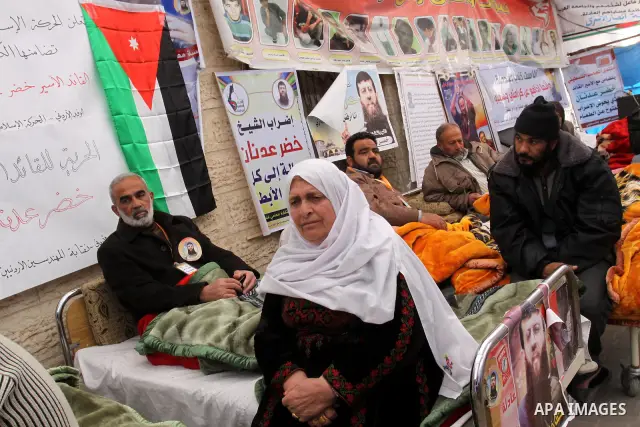 Palestinians on a hunger strike in solidarity with Palestinian prisoner Khader Adnan, a member of the Islamic Jihad militant group, during a protest in front of the Red Cross in Gaza City, calling for the release of Pale...