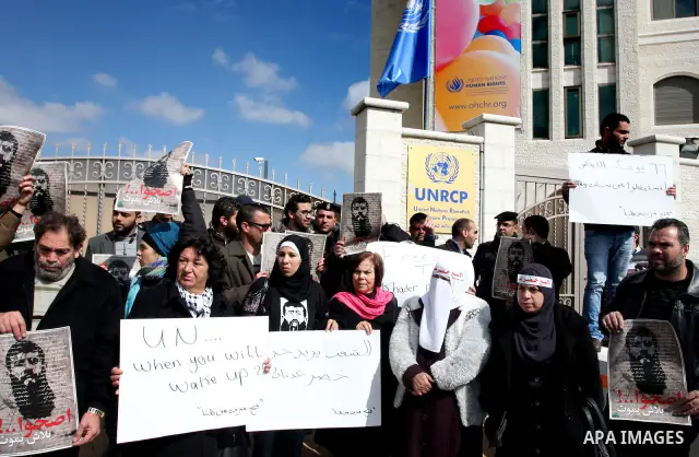 Palestinians participates in a protest in solidarity with Khader Adnan, 33, a senior member of Islamic Jihad jailed in Israel who has been on hunger strike for 65 days, and calling for the release of Palestinian prisoner...