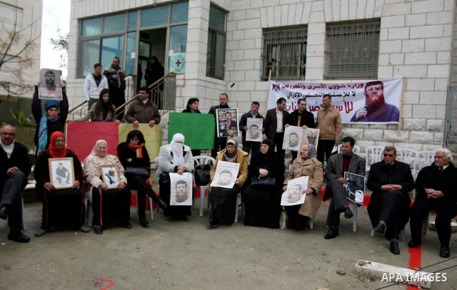 Palestinians participates in a protest in solidarity with Khader Adnan, 33, a senior member of Islamic Jihad jailed in Israel who has been on hunger strike for 65 days, and calling for the release of Palestinian prisoner...