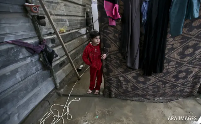 A Palestinian woman cooks inside her family home in the Jabaliya Refugee camp, Gaza Strip, 19 February 2012. The United Nations Relief and Works Agency (UNRWA) states that the Israeli blockade on Gaza has made life more...