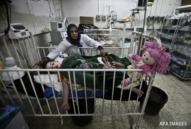 A nurse attends to a Palestinian infant in an incubator at Al-Nasser hospital in Gaza Strip on 20 February 2012. The hospital has been suffering from power cuts after the impoverished territory's sole power plant, that s...