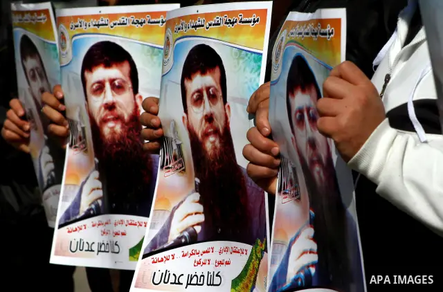 Palestinian supporters of the Islamic Jihad militant group participate in a protest in solidarity with Khader Adnan, a senior member of Islamic Jihad jailed in Israel who has been on hunger strike for 66 days, in Gaza Ci...