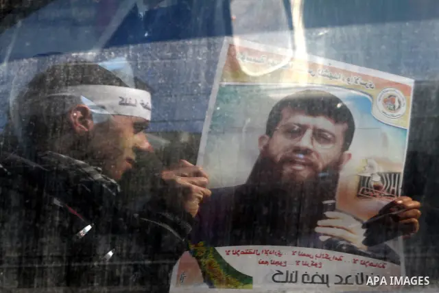Palestinian supporters of the Islamic Jihad militant group participate in a protest in solidarity with Khader Adnan, a senior member of Islamic Jihad jailed in Israel who has been on hunger strike for 66 days, in Gaza Ci...