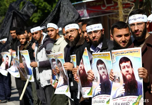 Palestinian supporters of the Islamic Jihad militant group participate in a protest in solidarity with Khader Adnan, a senior member of Islamic Jihad jailed in Israel who has been on hunger strike for 66 days, in Gaza Ci...