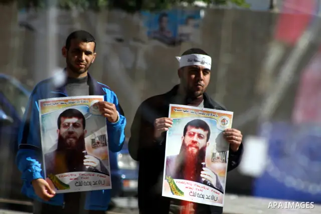 Palestinian supporters of the Islamic Jihad militant group participate in a protest in solidarity with Khader Adnan, a senior member of Islamic Jihad jailed in Israel who has been on hunger strike for 66 days, in Gaza Ci...