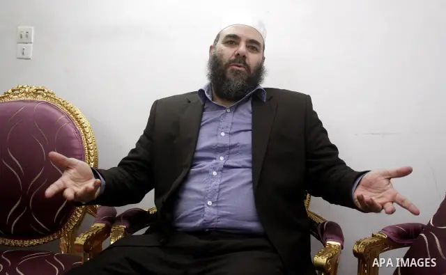 Egyptian Tareq al-Zomor, a member of Egypt's Islamic Jihad, speaks to media at his house in Cairo on Feb. 20, 2012. Al-Zomor, who jailed over the 1981 assassination of president Anwar Sadat, was released from Egyptian pr...