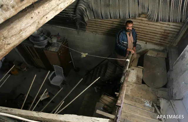 A Palestinian man climbs the stair inside his bad-built home in Khan Younis refugee camp in southern Gaza Strip, 21 February 2012. The United Nations Relief and Works Agency (UNRWA) stated that the Israeli blockade on Ga...