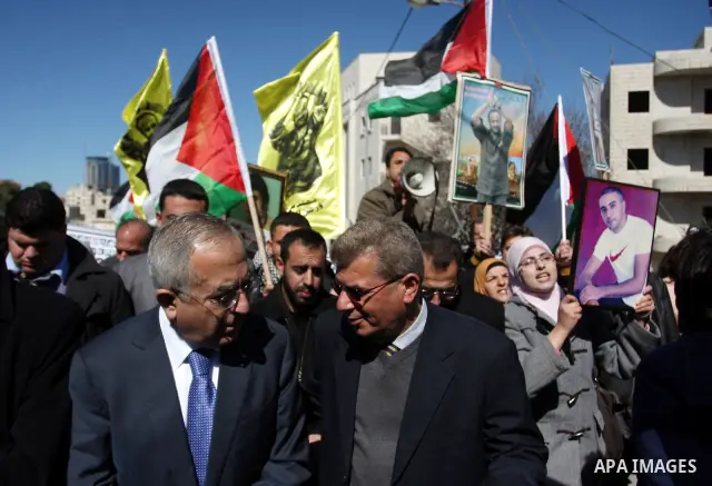 Palestinian Prime Minister Salam Fayyad, attends a protest in support of Islamic Jihad member Khader Adnan outside Ofer prison near the West Bank city of Ramallah February 21, 2012. Adnan, held without trial by Israel, a...