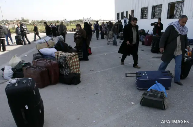 Palestinians wait to cross the Rafah border crossing in the southern Gaza Strip into Egypt on Feb. 22, 2012. Maher Abu Sabha, Director General of the crossings in the Gaza government resign from office an Interior Minist...