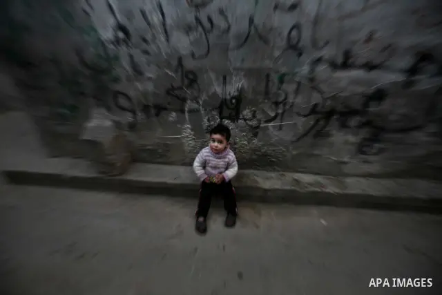 Palestinian children play in the streets of the Jabaliya refugee camp, northern Gaza Strip, 22 February 2012. The United Nations Relief and Works Agency (UNRWA) states that the Israeli blockade on Gaza has made life more...