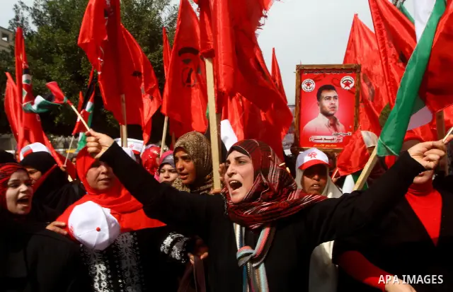 Supporters of the Democratic Front for the Liberation of Palestine (DFLP) shout slogans during a rally marking the 43rd anniversary of the movement's establishment in Gaza City on February 23, 2012. Photo by Ashraf Amra
