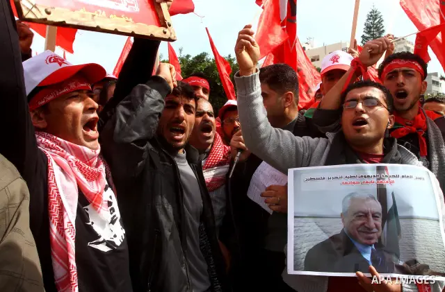 Supporters of the Democratic Front for the Liberation of Palestine (DFLP) shout slogans during a rally marking the 43rd anniversary of the movement's establishment in Gaza City on February 23, 2012. Photo by Ashraf Amra
