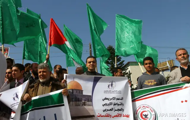 Palestinian protesters shout slogans during a demonstration in Gaza City on February 23, 2012 against the arrest of three Palestinians in Jerusalem's old city that houses the Al-Aqsa mosque compound after confrontations...