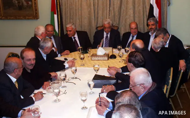 Egyptian intelligence chief Murad Muwafi, Palestinian President Mahmoud Abbas, and Hamas leader Khaled Meshaal, during a meeting between Fatah and Hamas in Cairo, Egypt, 23 February 2012. According to media reports, the...