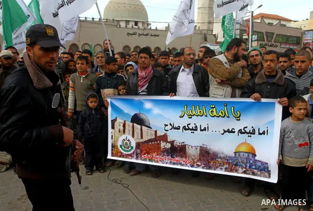 Palestinian protesters shout slogans as they gather in Khan Yunis in the southern Gaza Strip on February 24, 2012 during a demonstration to show solidarity for Jerusalem's Al-Aqsa mosque compound. Clashes briefly broke o...