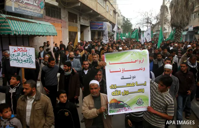 Palestinian protesters shout slogans as they gather in Khan Yunis in the southern Gaza Strip on February 24, 2012 during a demonstration to show solidarity for Jerusalem's Al-Aqsa mosque compound. Clashes briefly broke o...