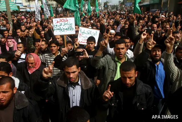 Palestinian protesters shout slogans as they gather in Khan Yunis in the southern Gaza Strip on February 24, 2012 during a demonstration to show solidarity for Jerusalem's Al-Aqsa mosque compound. Clashes briefly broke o...