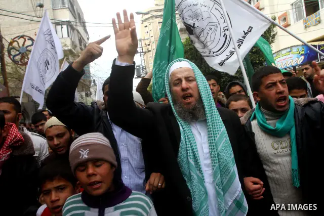 Palestinian protesters shout slogans as they gather in Khan Yunis in the southern Gaza Strip on February 24, 2012 during a demonstration to show solidarity for Jerusalem's Al-Aqsa mosque compound. Clashes briefly broke o...