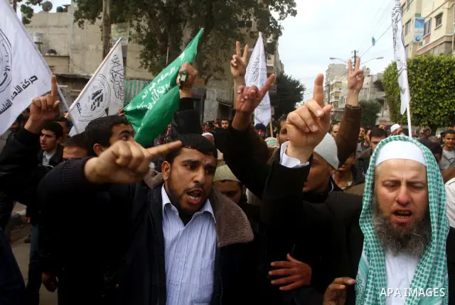 Palestinian protesters shout slogans as they gather in Khan Yunis in the southern Gaza Strip on February 24, 2012 during a demonstration to show solidarity for Jerusalem's Al-Aqsa mosque compound. Clashes briefly broke o...