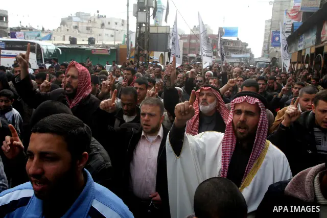 Palestinian protesters shout slogans as they gather in Khan Yunis in the southern Gaza Strip on February 24, 2012 during a demonstration to show solidarity for Jerusalem's Al-Aqsa mosque compound. Clashes briefly broke o...