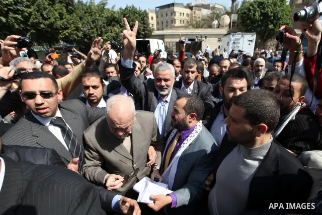 Hamas leader Ismail Haniyeh, flashes the victory sign as he arrives to perform the Friday noon prayer at Al-Azhar mosque, in Cairo, Egypt, 24 February 2012. According to media reports, Haniyeh joined hundreds of Egyptian...