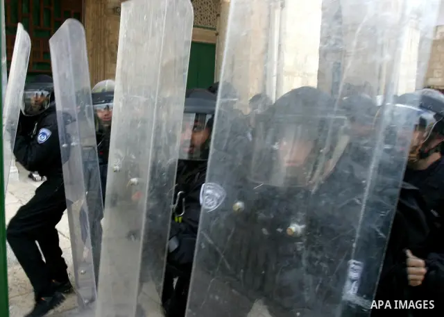 Israeli policemen stand guard during clashes with Palestinian protesters on the compound known to Muslims as the Noble Sanctuary and to Jews as the Temple Mount in Jerusalem's Old City February 24, 2012. Israeli policeme...
