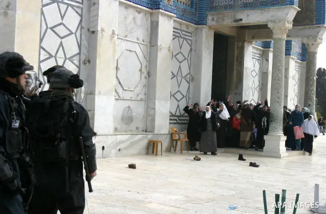 Palestinian women gesture as they shout at Israeli policemen during clashes with Palestinian protesters on the compound known to Muslims as the Noble Sanctuary and to Jews as the Temple Mount in Jerusalem's Old City Febr...