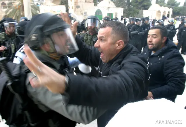 Palestinian women argue with Israeli riot police as they guard an entrance to the Dome of the Rock during running clashes on the compound known to Muslims as the Noble Sanctuary and to Jews as the Temple Mount in Jerusal...
