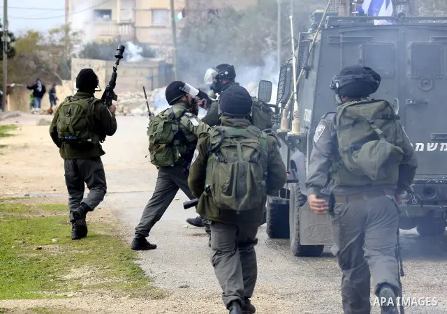 Palestinian protesters clash with Israeli soldiers during a demonstration against the expropriation of Palestinian land by Israel in the village of Kfar Qaddum, near the West Bank city of Nablus, on February 24, 2012. Ph...