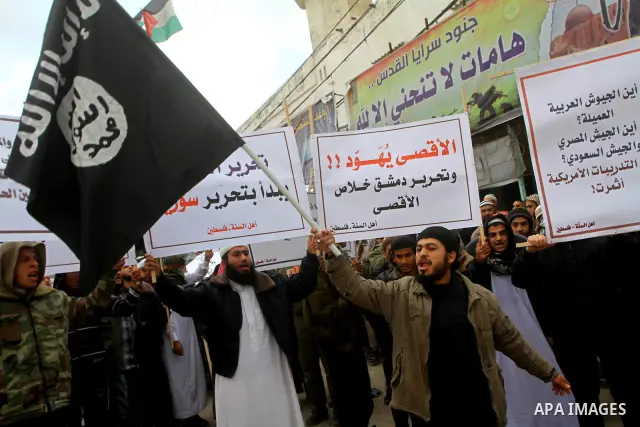 Palestinian Salafists take part in a protest against Syria's President Bashar al-Assad in Rafah in the southern Gaza Strip February 24, 2012. The black flag reads "There is no god but Allah and Mohammad is the prophet"....