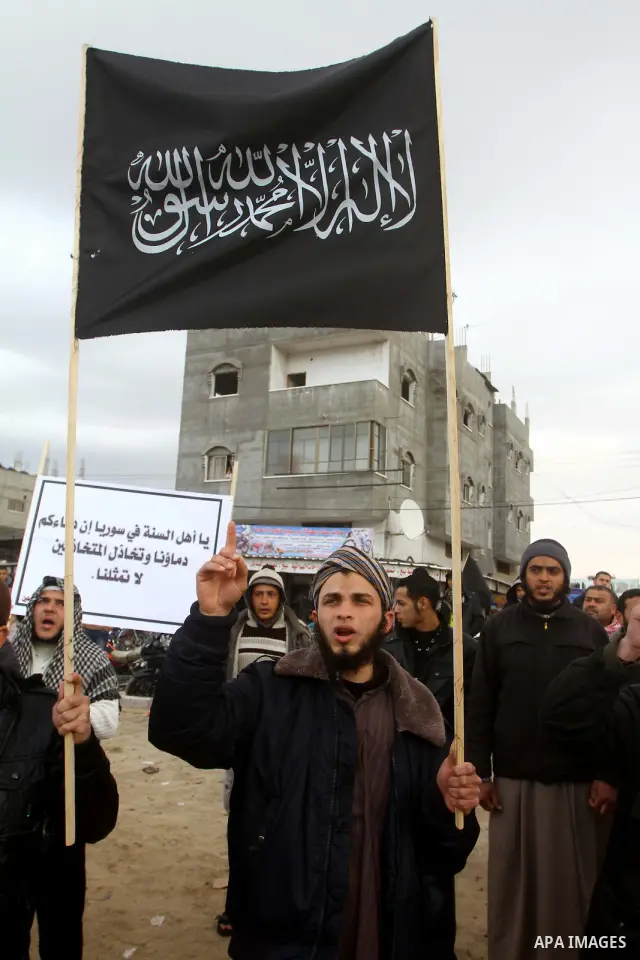 Palestinian Salafists take part in a protest against Syria's President Bashar al-Assad in Rafah in the southern Gaza Strip February 24, 2012. The black flag reads "There is no god but Allah and Mohammad is the prophet"....