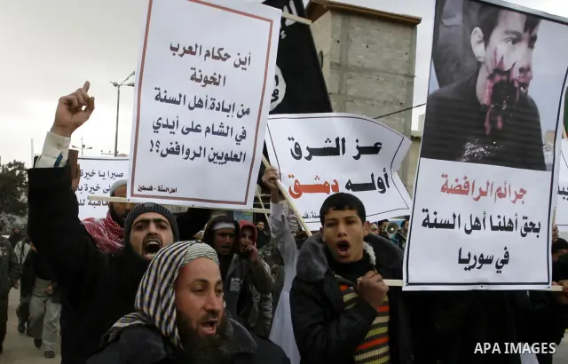 Palestinian Salafists take part in a protest against Syria's President Bashar al-Assad in Rafah in the southern Gaza Strip February 24, 2012. The black flag reads "There is no god but Allah and Mohammad is the prophet"....